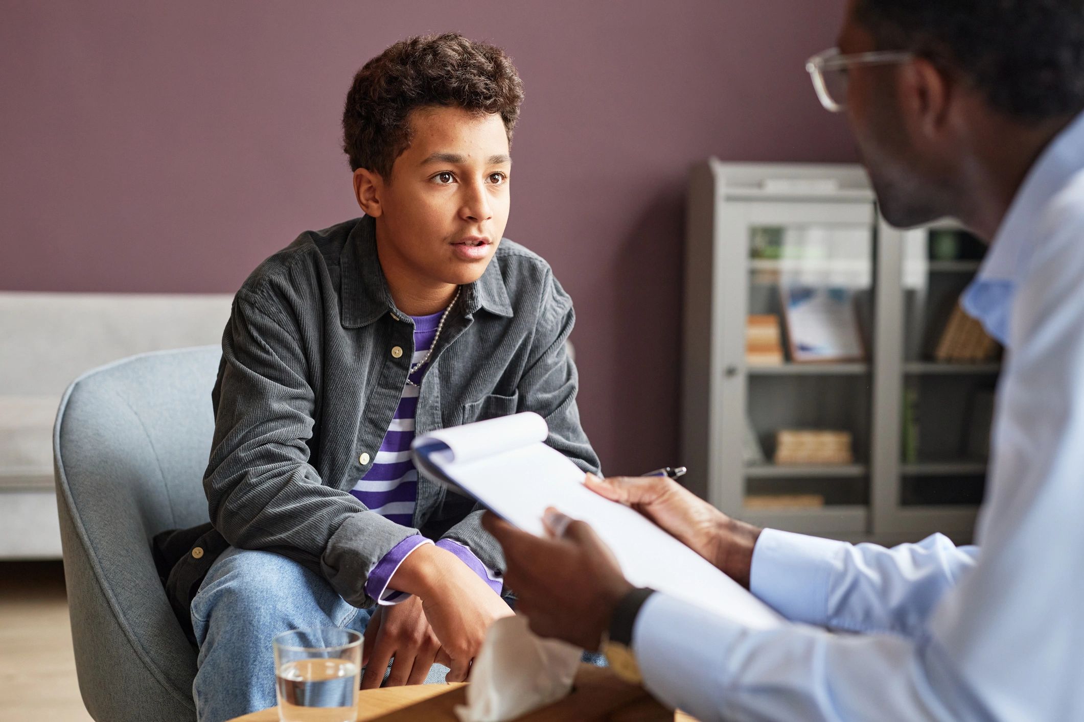 Excited teenage boy sharing his thoughts with adolescent